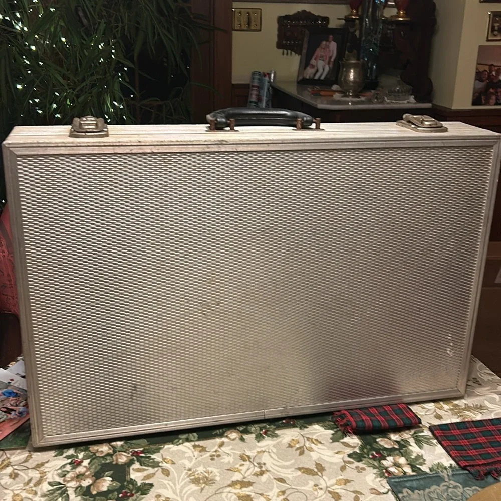 Aluminum padded case, handy for carrying anything; 24”long, 13.5”wide 4” deep